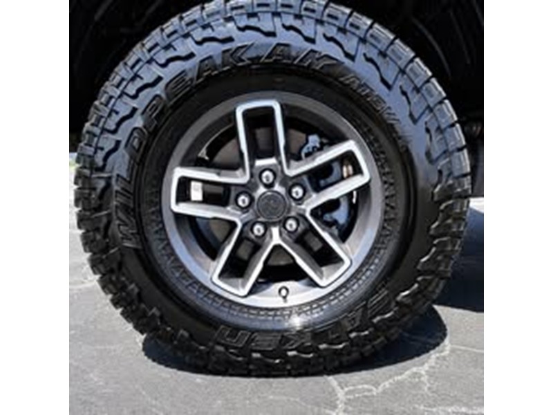 2026 Jeep Gladiator Mojave X LT285-70R17-C Tires and OEM factory wheels and Rock Rails 2