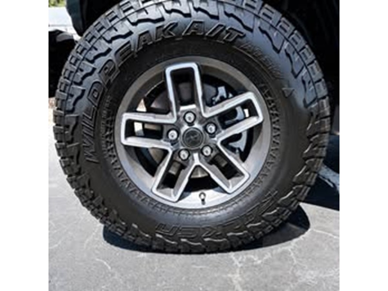 2026 Jeep Gladiator Mojave X LT285-70R17-C Tires and OEM factory wheels and Rock Rails 3