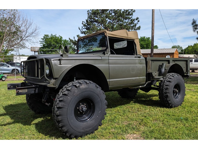 Four M715 Kaiser Army Trucks